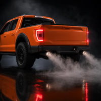 Close-up of the exhaust mist effect and glowing LED tail lights